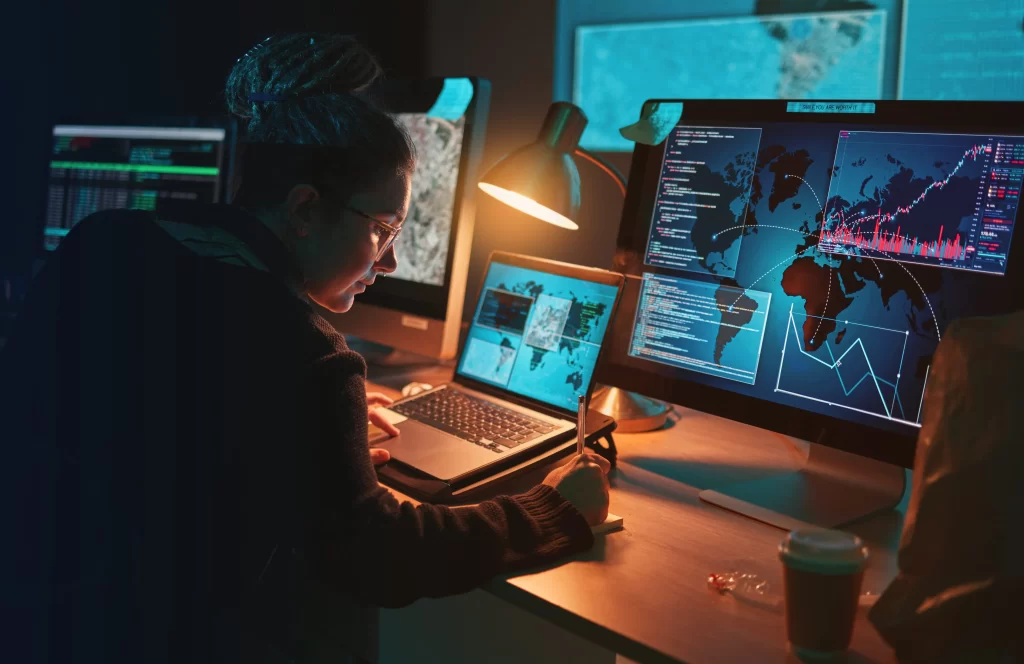 Cybersecurity woman writing technical security information 1024x664